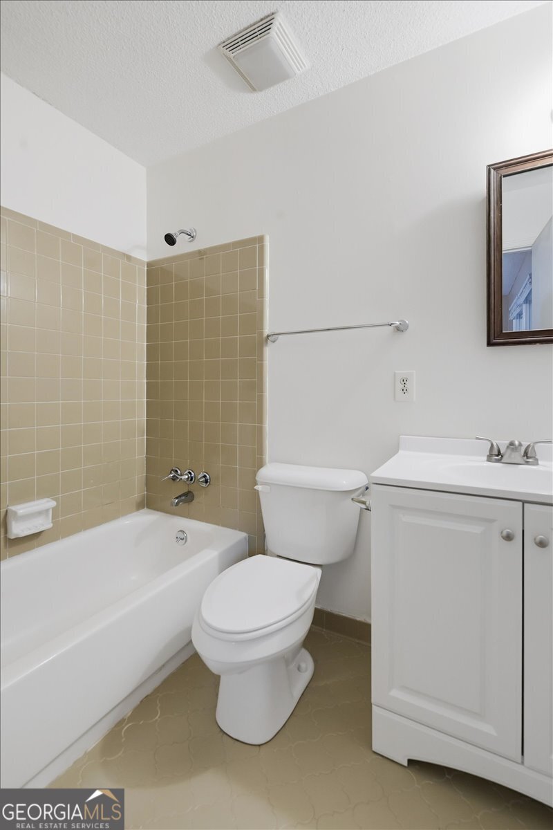 223 Randy Circle Warner Robins, GA 31088 - Photo 17 of 27 a bathroom with a toilet and a bathtub