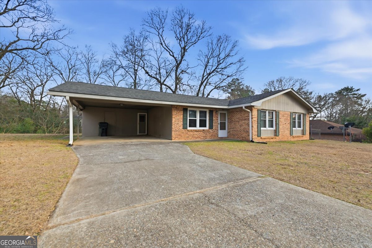 223 Randy Circle Warner Robins, GA 31088 - Photo 2 of 27 front view of a house with a yard and trees