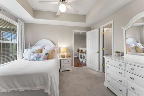 a bedroom with a bed and a dresser