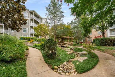 a view of a garden with a house
