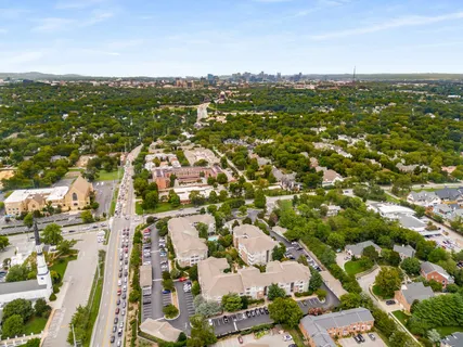an aerial view of residential houses with outdoor space