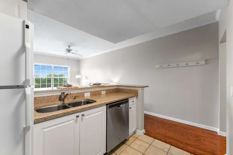 a kitchen with a sink and cabinets