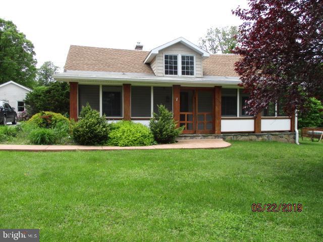 24837 Pen Mar Road Cascade, MD 21719 - Photo 1 of 32 a front view of a house with a yard