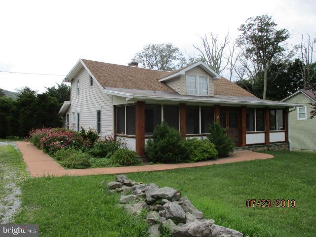24837 Pen Mar Road Cascade, MD 21719 - Photo 2 of 32 a front view of a house with a yard and porch