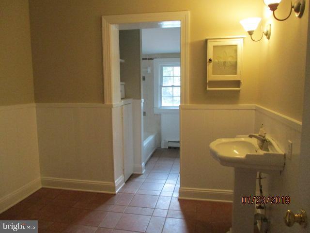 24837 Pen Mar Road Cascade, MD 21719 - Photo 16 of 32 a bathroom with sink and mirror