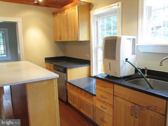24837 Pen Mar Road Cascade, MD 21719 - Photo 7 of 32 a kitchen with stainless steel appliances granite countertop a sink a stove and a microwave