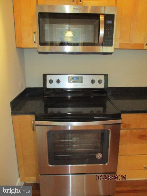 24837 Pen Mar Road Cascade, MD 21719 - Photo 10 of 32 a stove top oven sitting inside of a kitchen