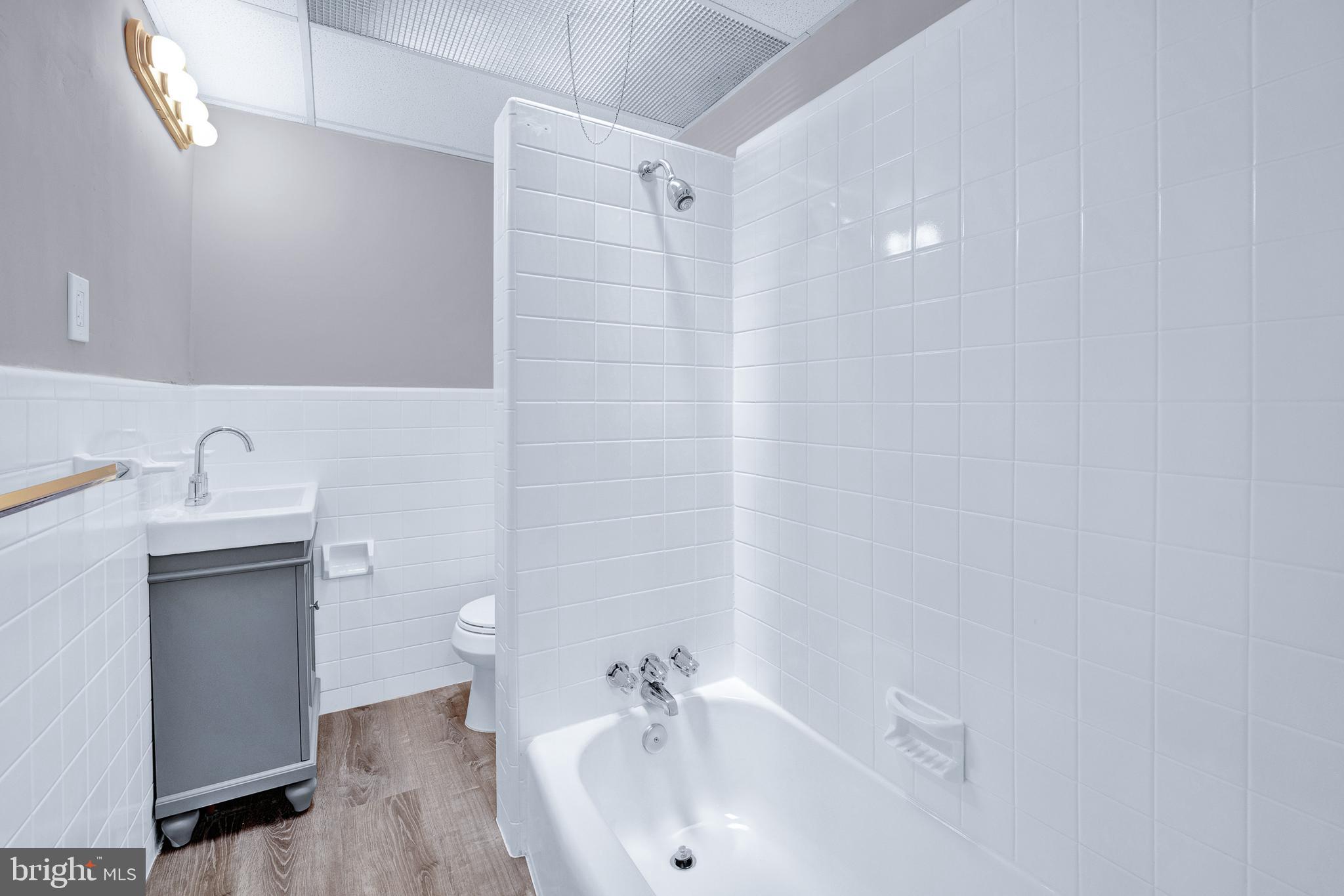 2610 Hobson Street Philadelphia, PA 19142 - Photo 13 of 13 a bathroom with a sink a toilet and shower