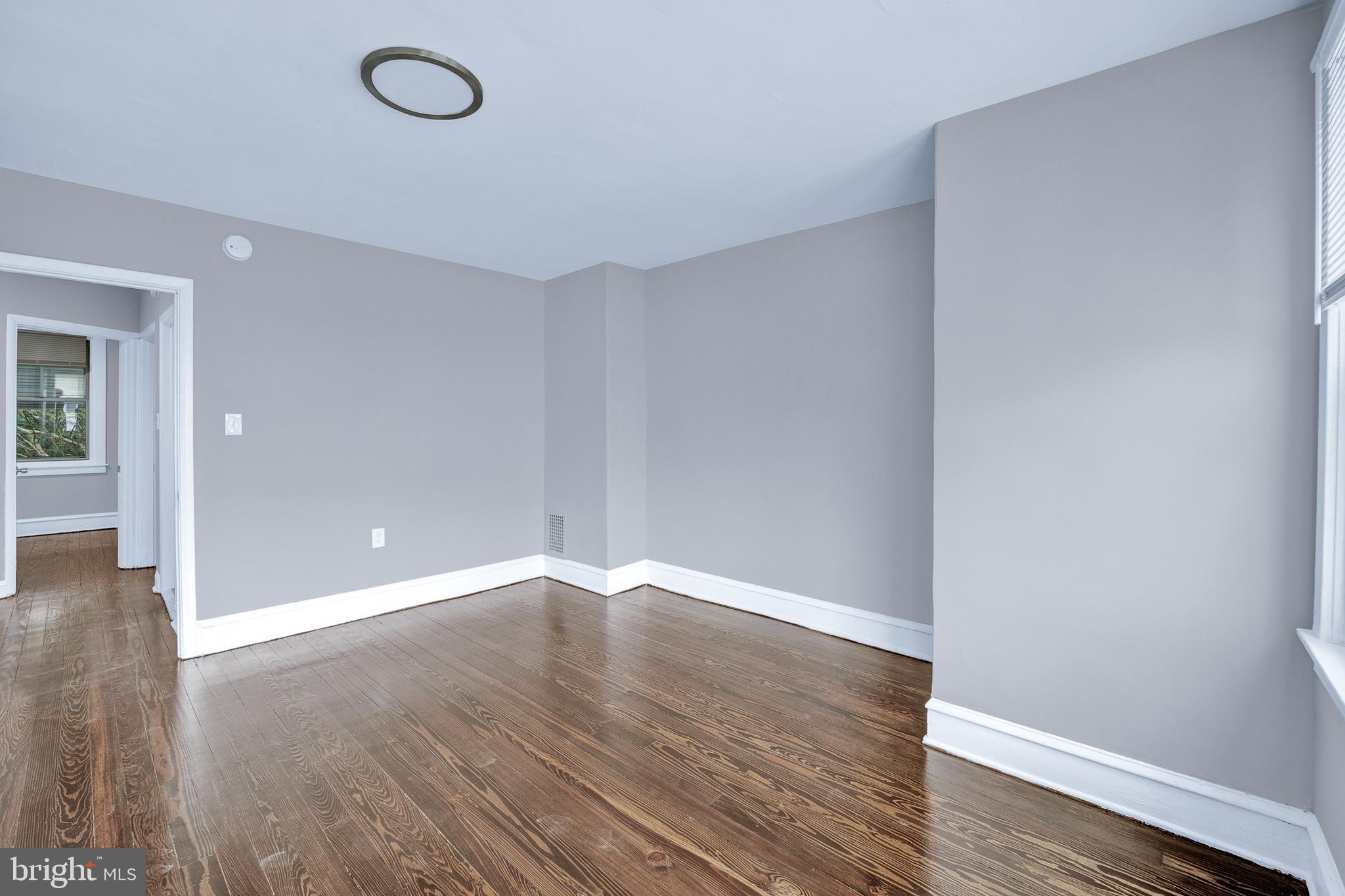 2610 Hobson Street Philadelphia, PA 19142 - Photo 9 of 13 a view of an empty room with wooden floor
