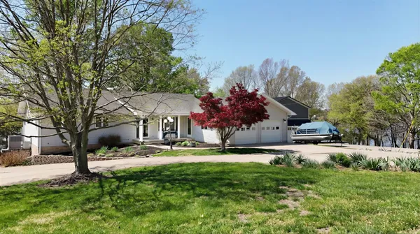 a view of a backyard with a patio