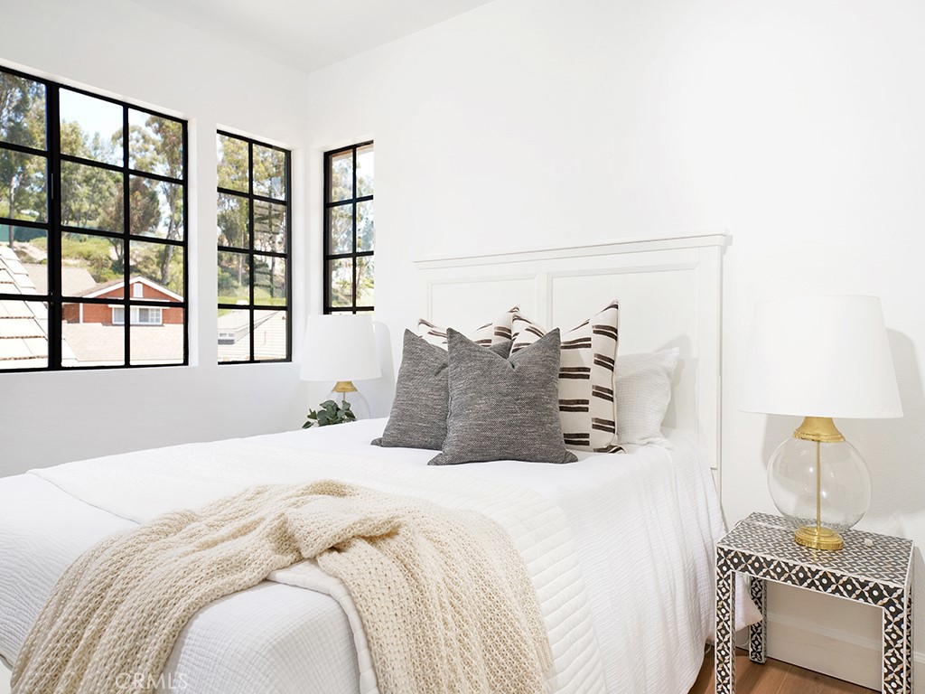 24912 Danamaple Dana Point, CA 92629 - Photo 20 of 36 a bedroom with a large bed and a window