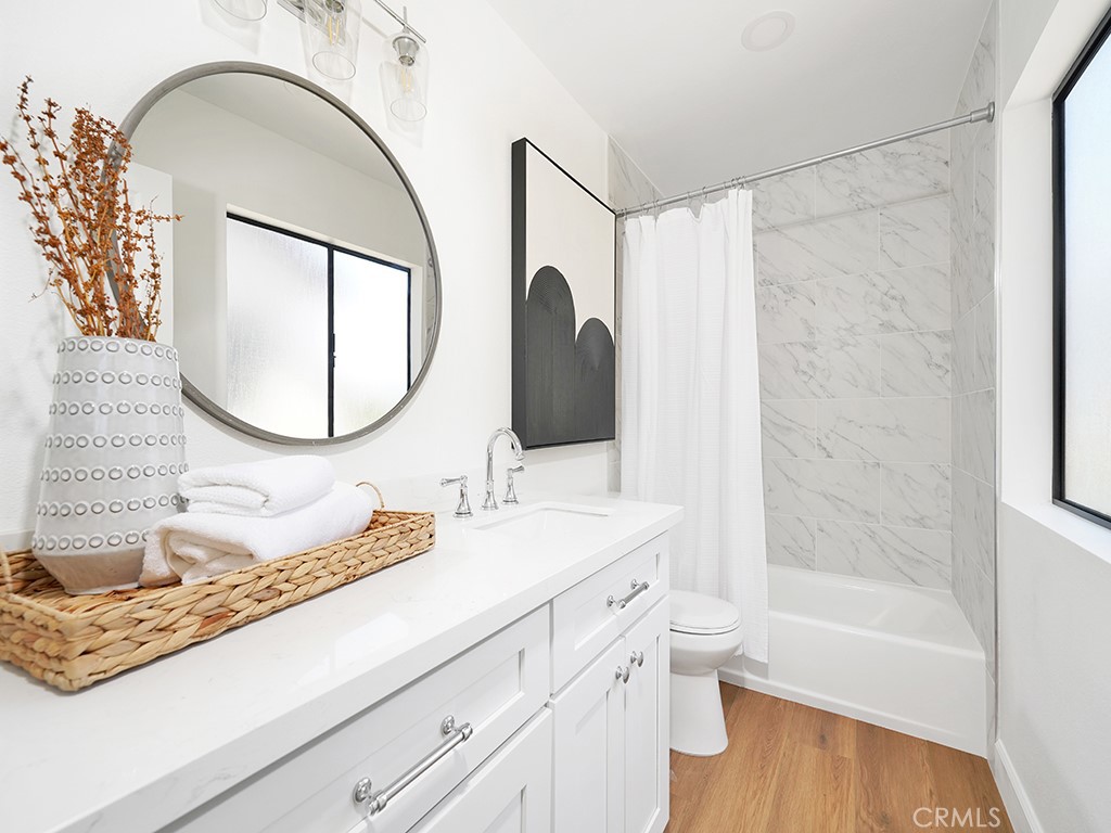 24912 Danamaple Dana Point, CA 92629 - Photo 23 of 36 a bathroom with a granite countertop sink mirror vanity and a bathtub