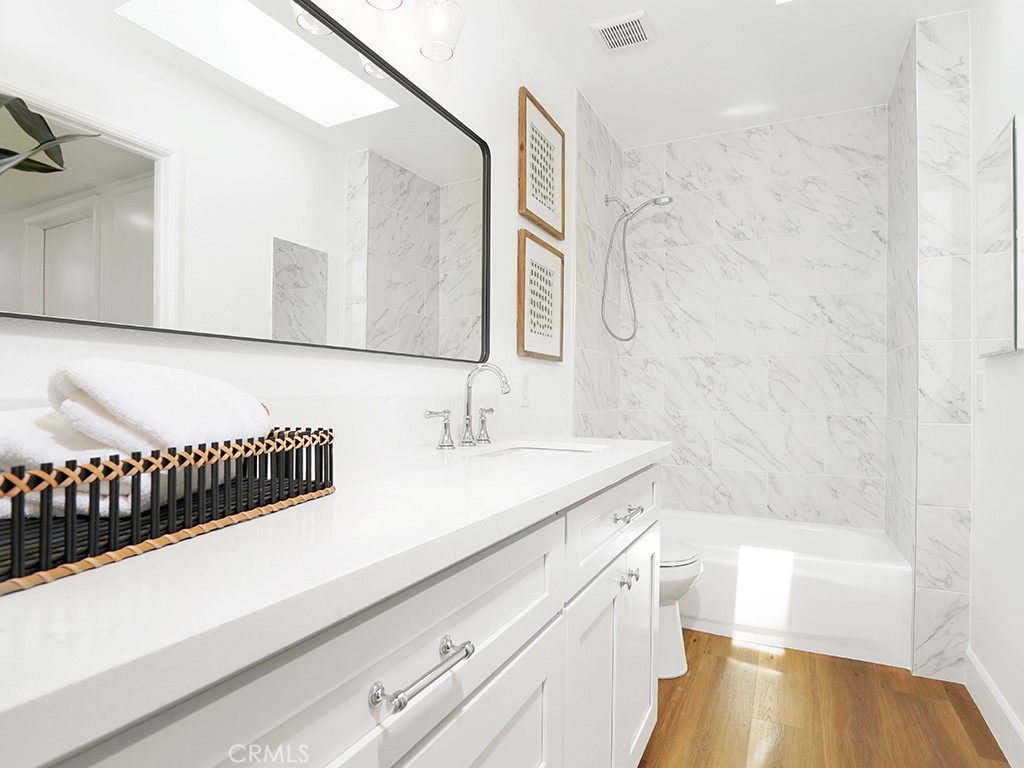 24912 Danamaple Dana Point, CA 92629 - Photo 25 of 36 a bathroom with a sink and a bathtub