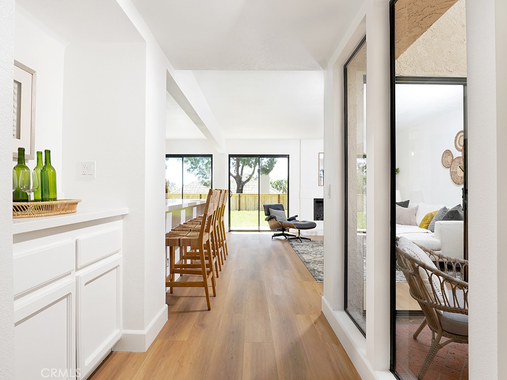 24912 Danamaple Dana Point, CA 92629 - Photo 26 of 36 a view of a bedroom with wooden floor and furniture
