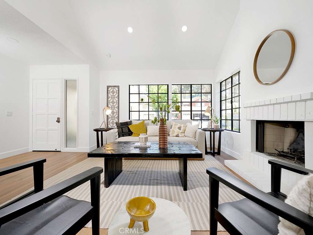 24912 Danamaple Dana Point, CA 92629 - Photo 30 of 36 a living room with furniture a flat screen tv and a fireplace