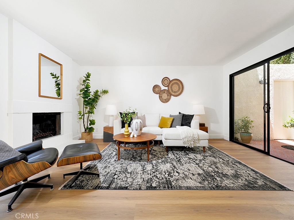 24912 Danamaple Dana Point, CA 92629 - Photo 32 of 36 a living room with furniture floor to ceiling window and a fireplace