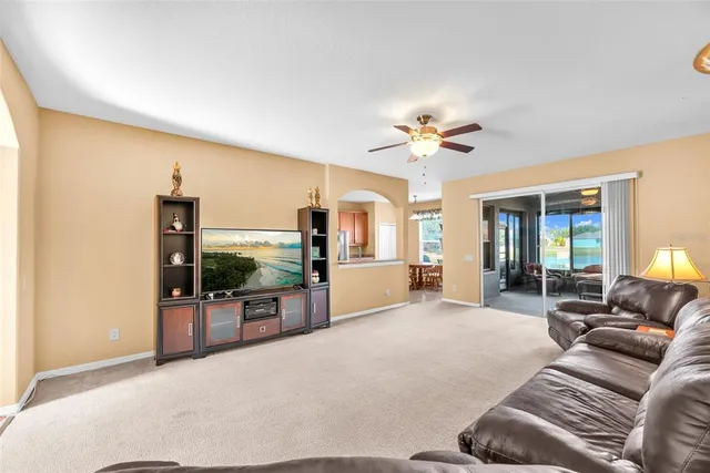 a kitchen with granite countertop stainless steel appliances a refrigerator sink and microwave