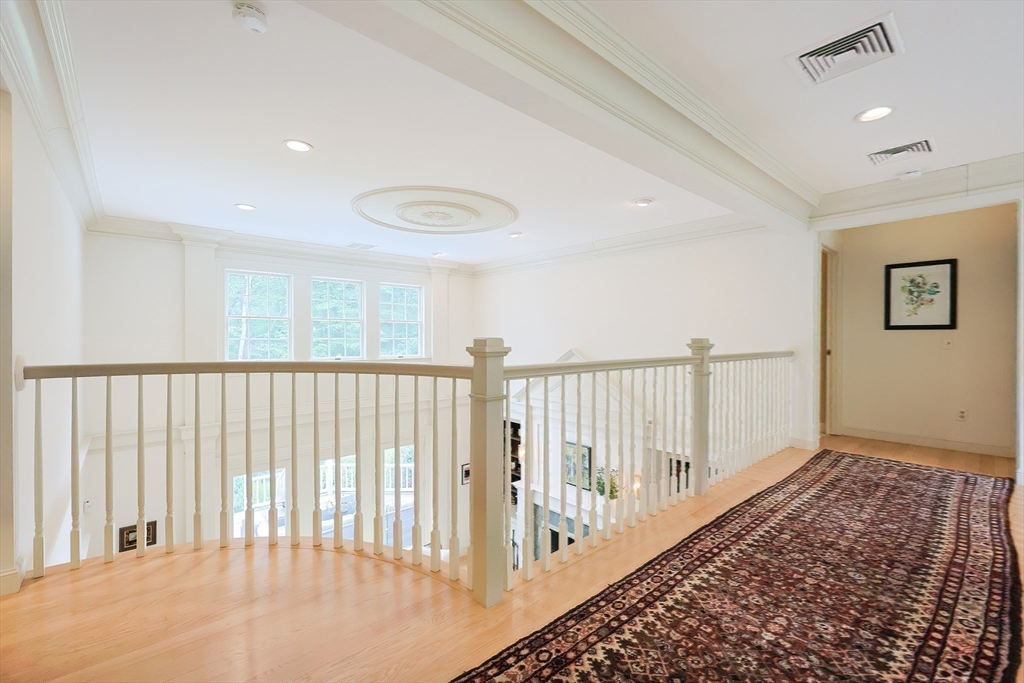 83 High Ridge Road Boxford, MA 01921 - Photo 29 of 42 a view of a hallway with wooden floor