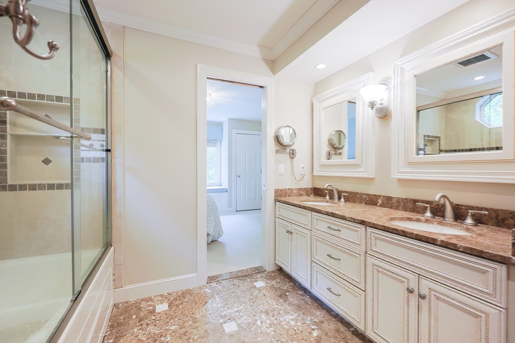 83 High Ridge Road Boxford, MA 01921 - Photo 31 of 42 a spacious bathroom with a granite countertop sink mirror and a shower