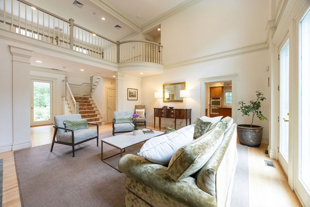 83 High Ridge Road Boxford, MA 01921 - Photo 7 of 42 a living room with furniture or couch and a dining table next to a window