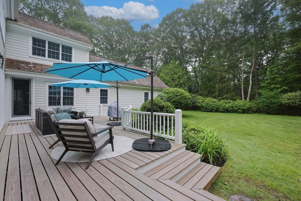 83 High Ridge Road Boxford, MA 01921 - Photo 8 of 42 a view of a deck with furniture and a yard