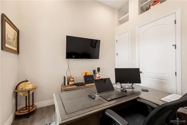 a view of a workspace with furniture
