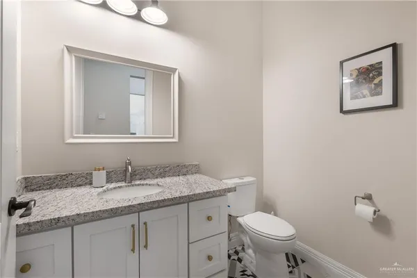 a view of a kitchen with sink and cabinets