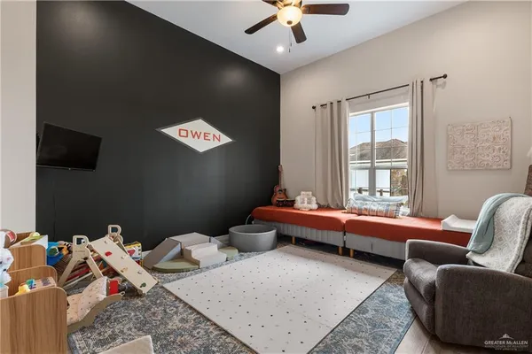 a living room with furniture and a rug