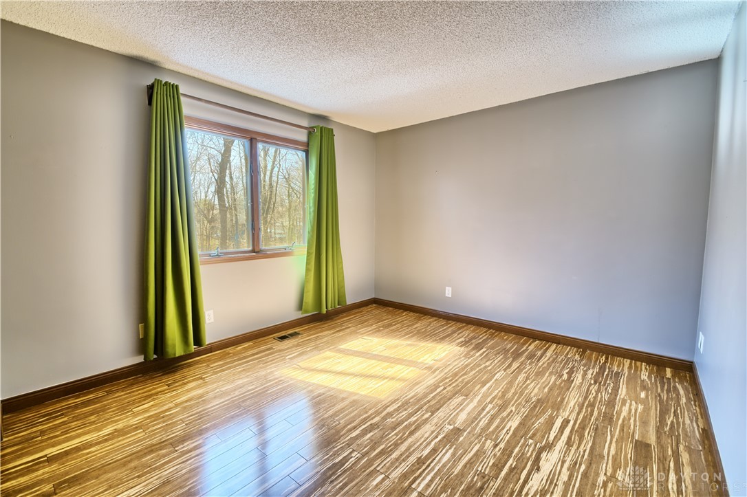 8711 Nicole Lane Springboro, OH 45066 - Photo 55 of 87 This spacious room features ample natural light and durable wood flooring.