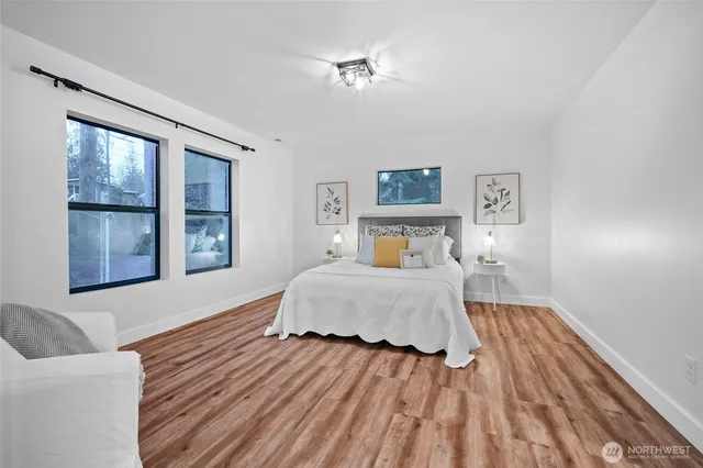 a bedroom with a bed and window