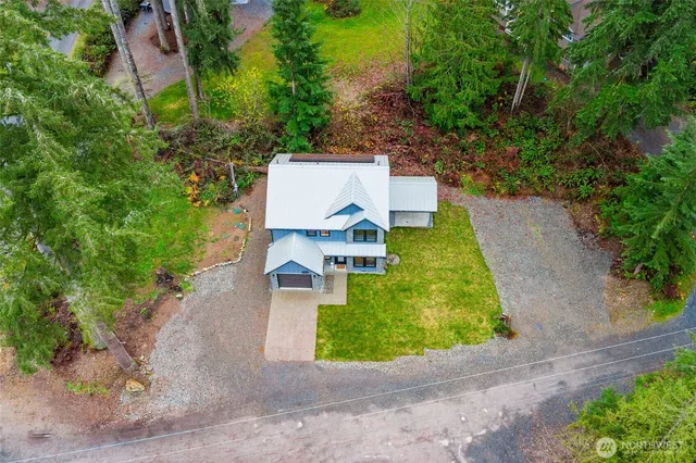 an aerial view of a house with outdoor space