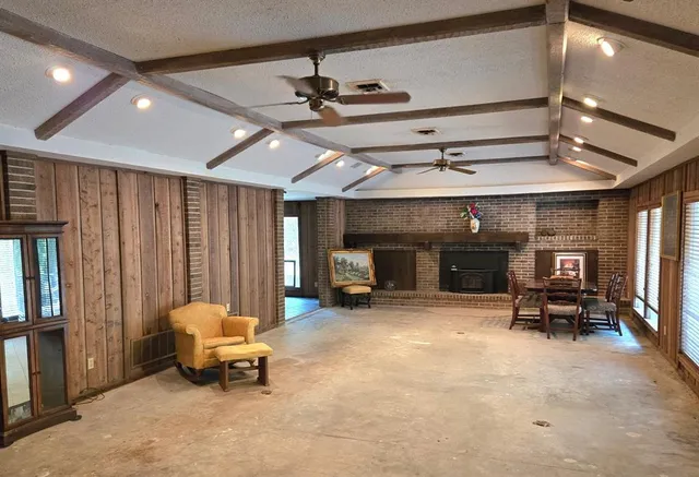 a view of a livingroom with furniture and a fireplace