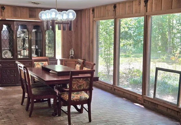 a view of a dining room with furniture window and outside view