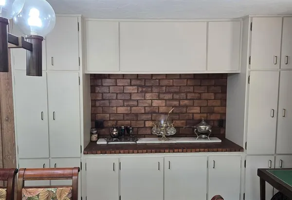 a kitchen with a sink and cabinets