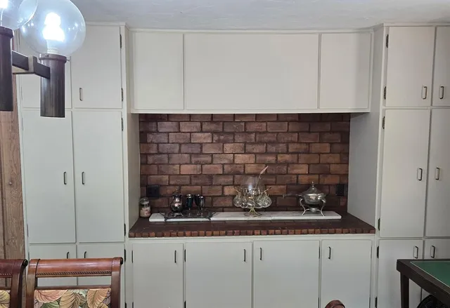 a kitchen with a sink and cabinets