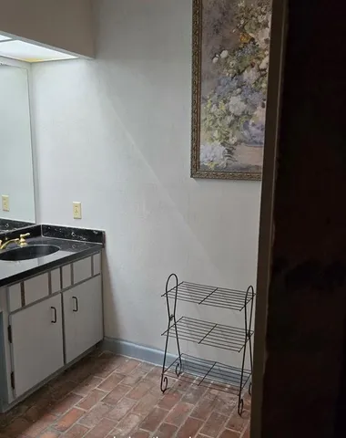 a view of a hallway with washer and dryer