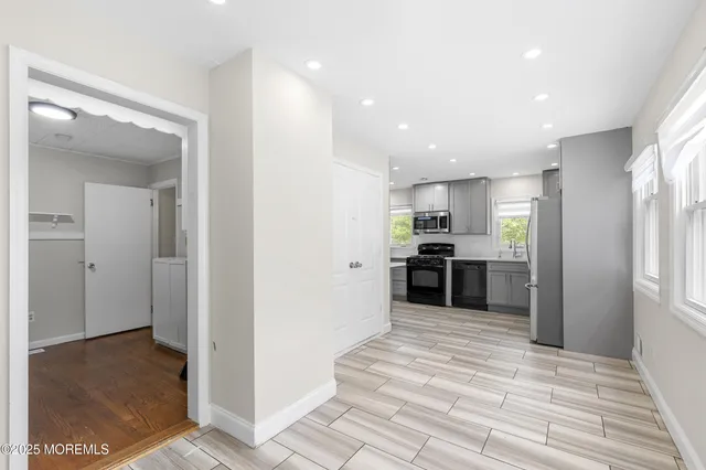 a view of kitchen with wooden floor