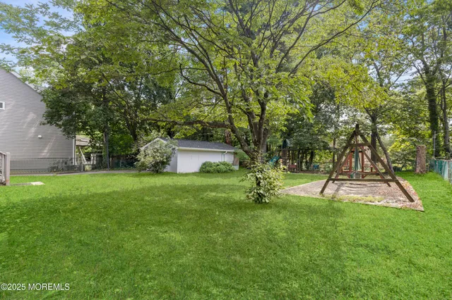 a view of a backyard with a garden and trees