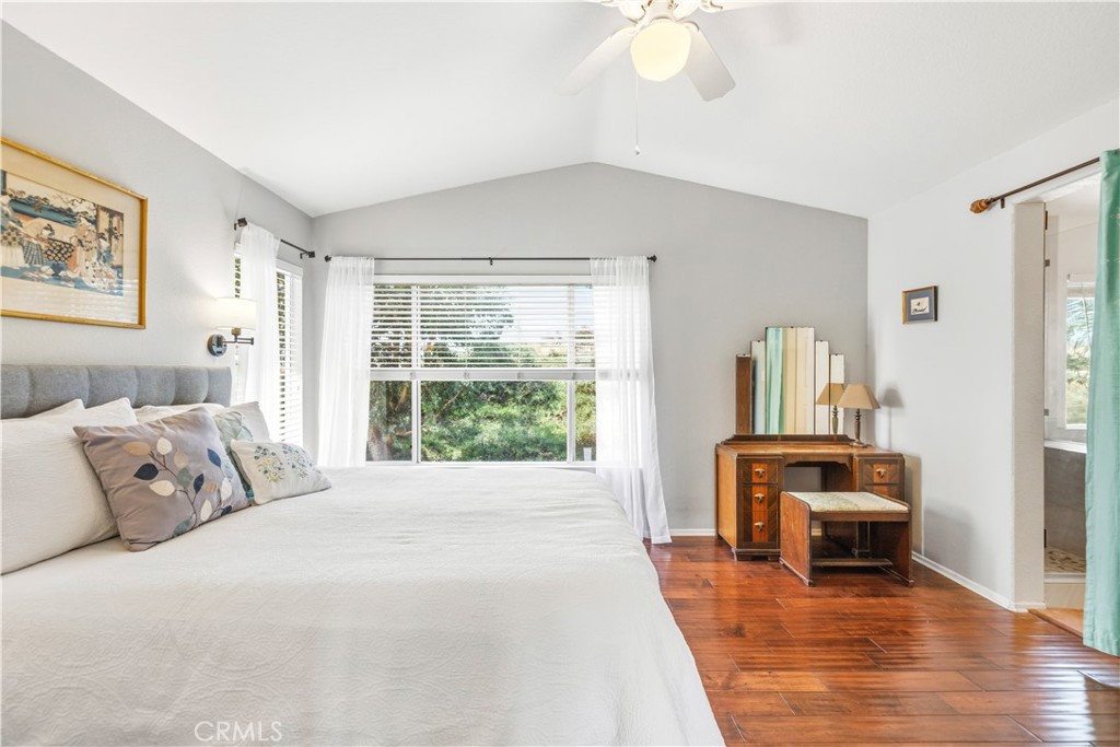 28033 Memory Lane Valencia, CA 91354 - Photo 24 of 40 a spacious bedroom with a bed and a large window