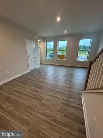 a view of a house with a wooden deck