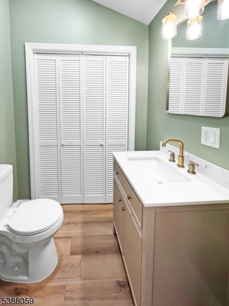 86 Heckman Street Phillipsburg, NJ 08865 - Photo 11 of 24 a bathroom with a sink toilet and mirror