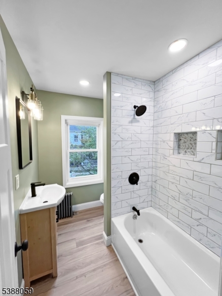 86 Heckman Street Phillipsburg, NJ 08865 - Photo 16 of 24 a bathroom with a tub sink and mirror