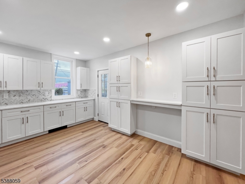 86 Heckman Street Phillipsburg, NJ 08865 - Photo 7 of 24 a kitchen with white cabinets and white appliances