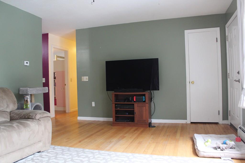 58 Corey Hill Road Ashburnham, MA 01430 - Photo 3 of 13 a living room with furniture and a flat screen tv