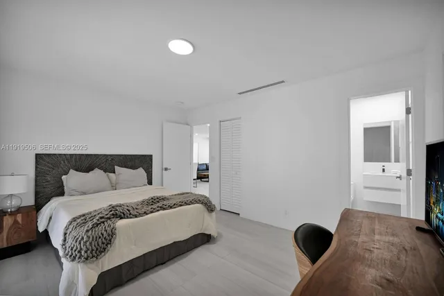 a bed room with a bed and a couch