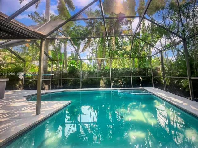 a view of a backyard with a small swimming pool