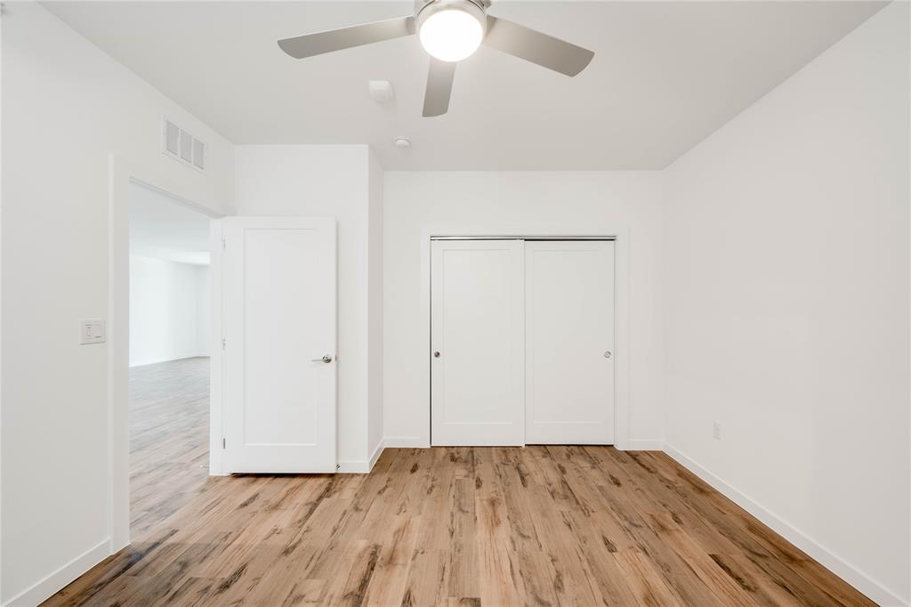 4801 Springdale Road, Unit 1307 Austin, TX 78723 - Photo 14 of 30 wooden floor in an empty room