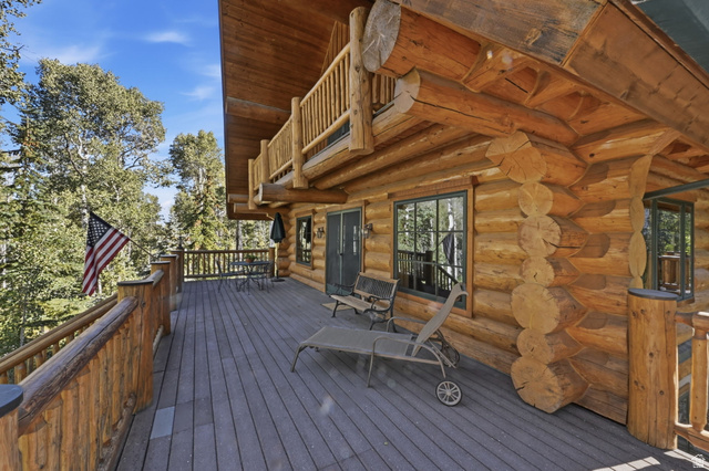 11192 Maple Road, Unit 7 Heber City, UT 84032 - Photo 6 of 51 Expansive composite deck featuring composite decking and wooden railings, with direct access to the log cabin exterior