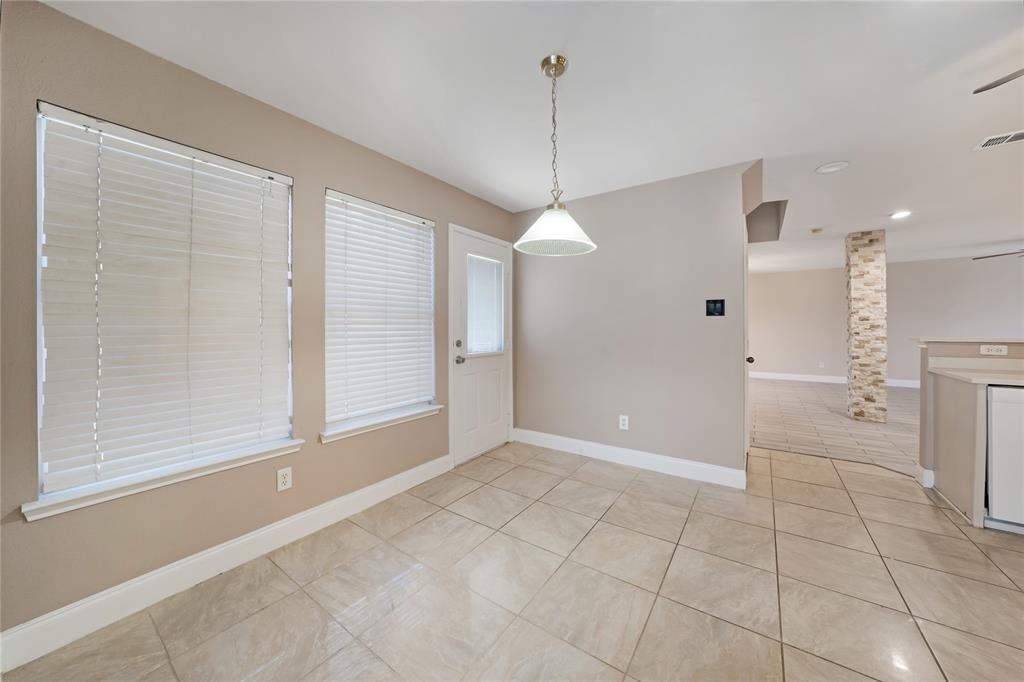 13241 Ridgepointe Road Fort Worth, TX 76244 - Photo 12 of 31 a view of a kitchen with an empty space and a window