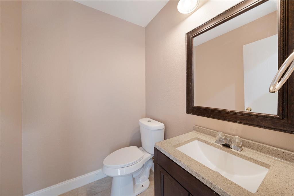 13241 Ridgepointe Road Fort Worth, TX 76244 - Photo 13 of 31 a bathroom with a sink and a toilet